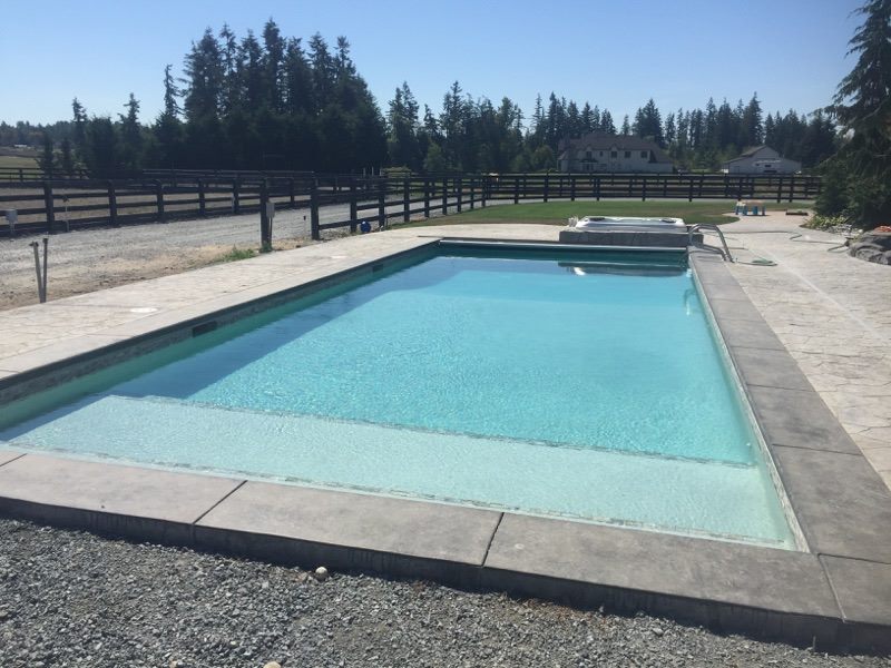 rectangular pool with tanning ledge