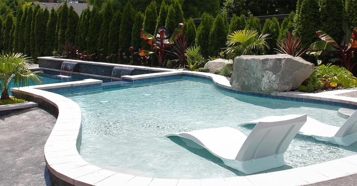 inground pool with spillover tanning ledge and waterfalls 1