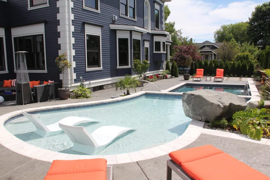 inground pool with spillover tanning ledge and waterfalls 2