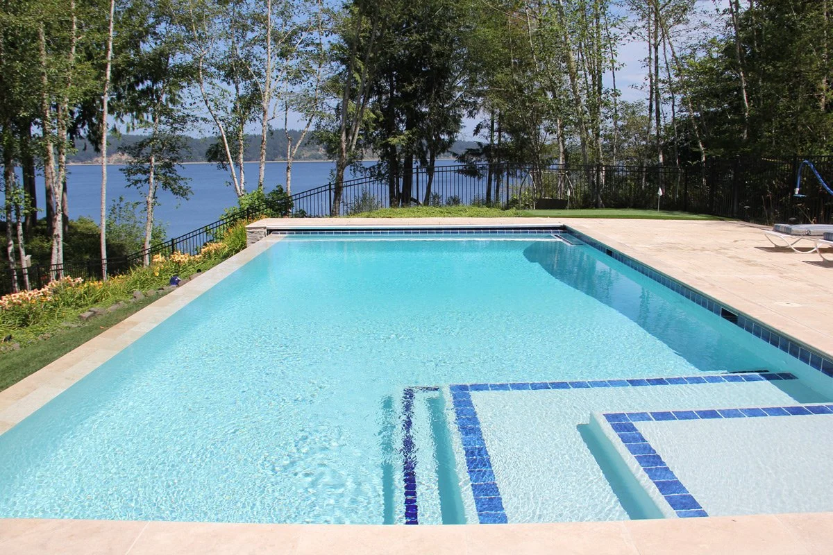 semi inground rectangular infinity pool 6