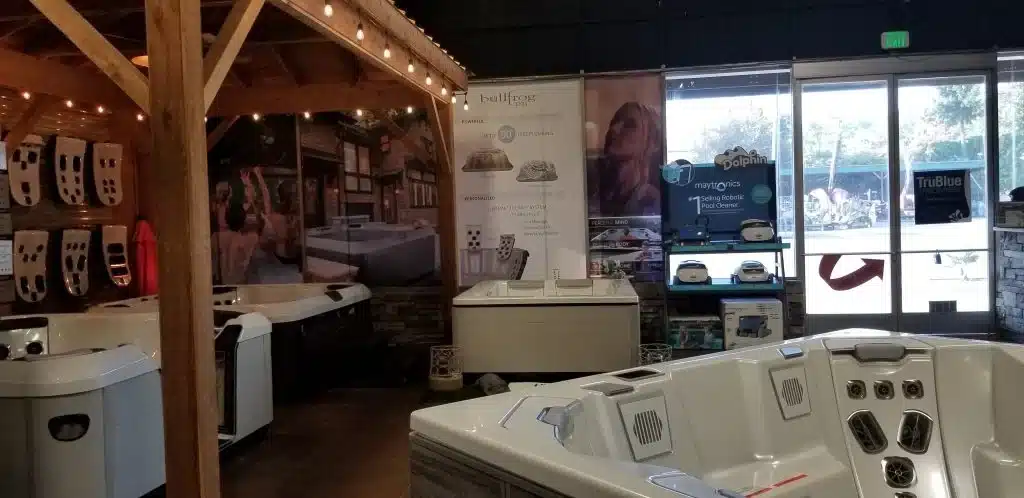 aqua rec's fireside hearth n' home tacoma showroom displaying hot tubs and accessories.