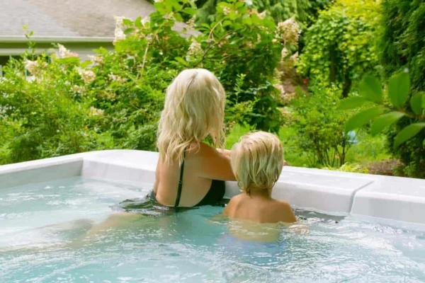 woman with child in clearwater spa in garden